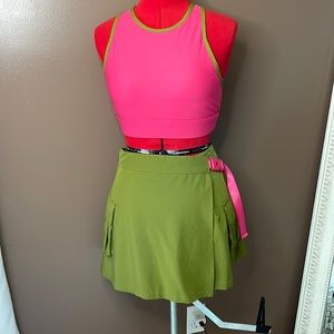 Fabletics hot pink sports bra and green wrap skirt matching set